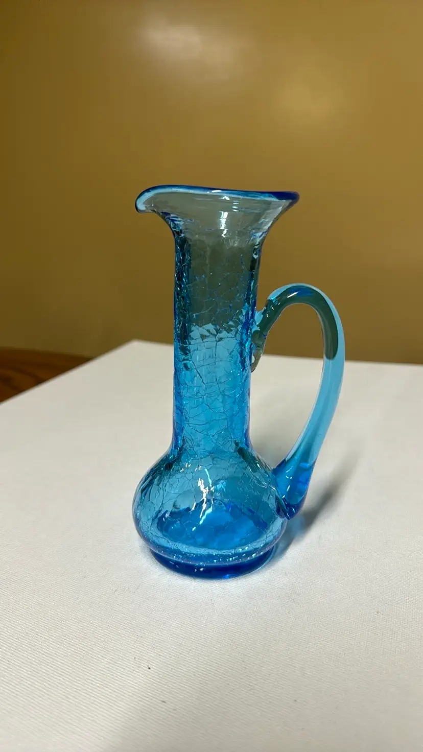 Crackle glass pitcher blue with uranium glow 6.25” tall