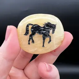 019. Pebble Stone With Carved Horse