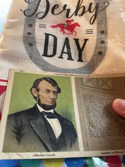 Derby Day tablecloth and Abe postcard