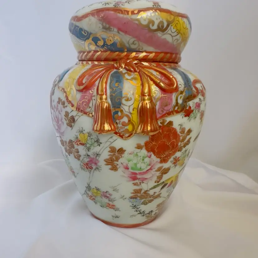 #1870 Vintage Japanese Kutani Porcelain Lidded Ginger Jar Reds And Golds Flowers 60-70’s, Raised Relief Bow And Tassels