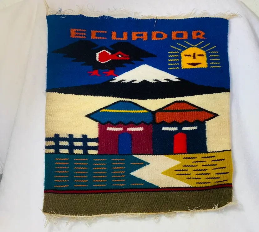 45 Vintage Ecuador Woven Wall Hanging or Placemat, Vintage Boho Woven Peruvian Tapestry, 80's Woven Wall Hanging or Small Rug Made in Ecuador Ben Franklin Arts Signed Handmade Finished Featuring A Condor Village Home And A Snow Cover Mountain Peak Wall Art with Frame 15” By 15” Un-Framed