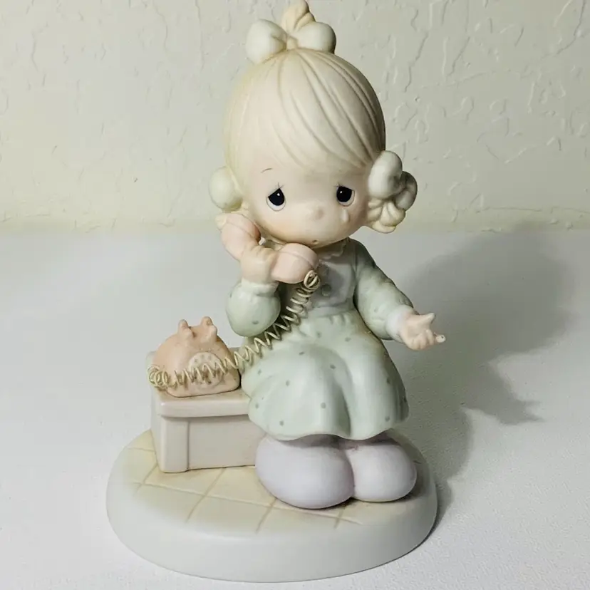 Retro Precocious Moments Girl Figurine Wearing Very Light Blue Dress On An Old Fashion Corded Land Line Telephone Speaking With God Bisque Porcelain 