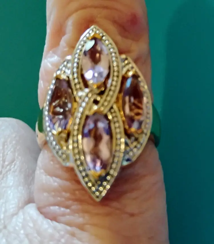 Ring is 925 Silver, New With Tag, Size 8, 4-Aymethest, 1-Diamond next to the Makers Initials on the side of the ring.