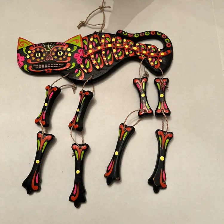 Alejibre Cat with dangling legs, beautiful bright colors on black