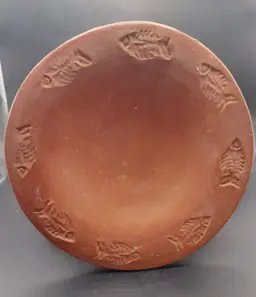 Small vintage terra cotta bowl stamped with fish