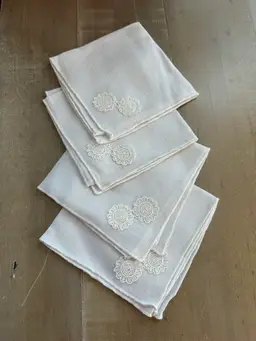 4 vintage white cotton or linen napkins with an embroidered floral design