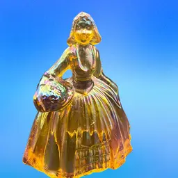 Vintage 1970’s Iridescent Amber/orange  carnival glass colonial lady figurine 5” by Wheatonware. Made In Millville, New Jersey