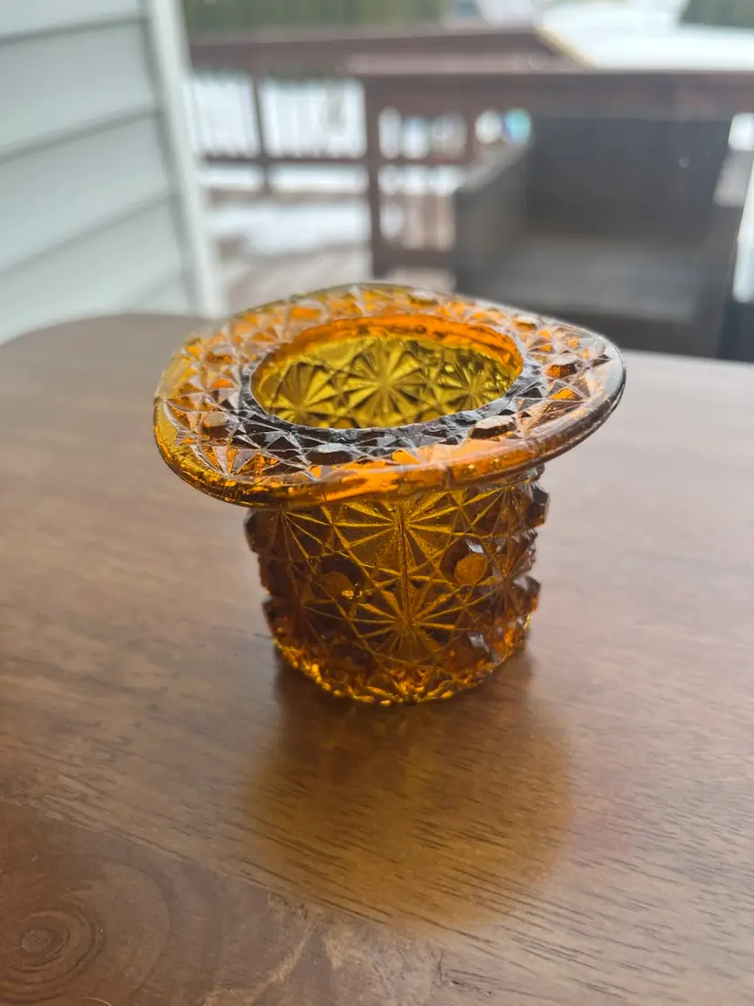 Vintage amber glass 'Daisy and Button' top hat toothpick holder. 2”