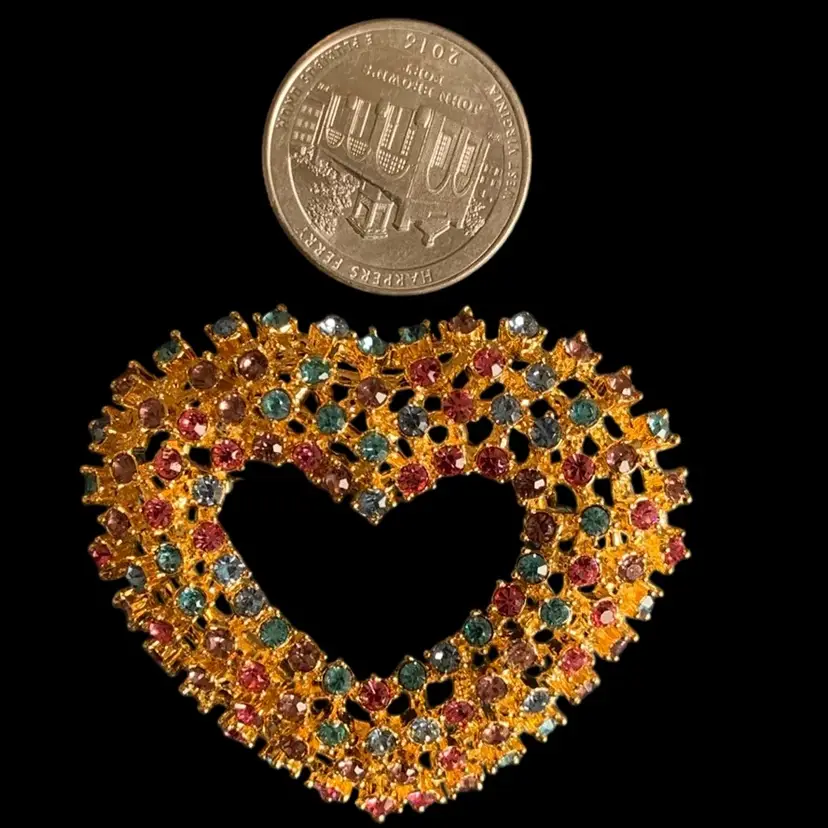 #33 - Large Gold Tone Heart Shape Brooch  With In Center  Cut Out Heart Shape  With Milt-color Rhinestones
