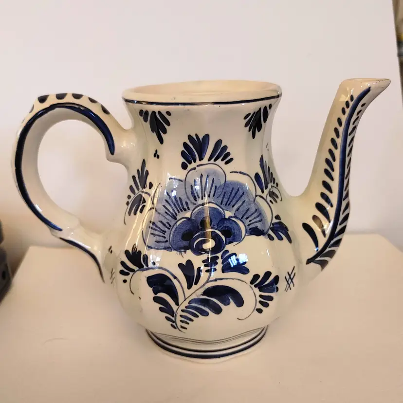 Delft blue pitcher. From Holland. 4.5w x 5.5h x 7.5d. No condition issues.