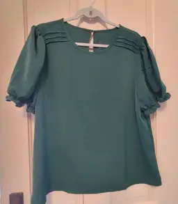 Top- Brand: Unknown. Solid green top. Size XL. Material- 95 polyester, 5 spandex. No callouts.