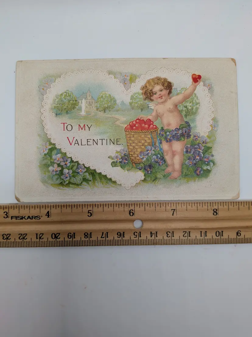 E121. Antique Postcard EMBOSSED Cherub Valentine Valentine's Day Florals Flowers Hearts Made in Germany