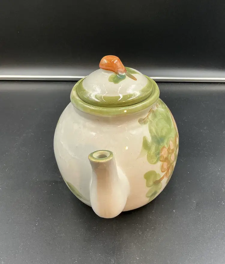 Louisville Stoneware “Harvest” tea pot, chip inside lid.