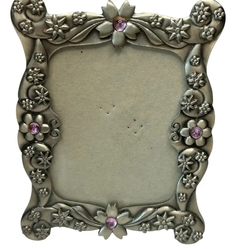 #01 - Christian World ( Mark Steven’s Industries) 
3 1/2x2 1/2 Picture Size 5x4 Frame Size 
Pewter Metal Frame With Purple Stones Floral Design