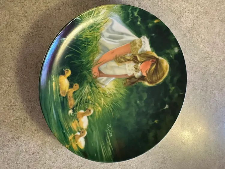 Porcelain collector plate titled 'Golden
Moment' by Donald Zolan