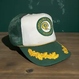 VTG US Cap Inc. Wisconsin Green Bay Packers Alumni Mesh Had Rope Scrambled Eggs  The foam inside the hat is flaking away. All but 1 of the adjustable plastic nubs have broken off. See pic.