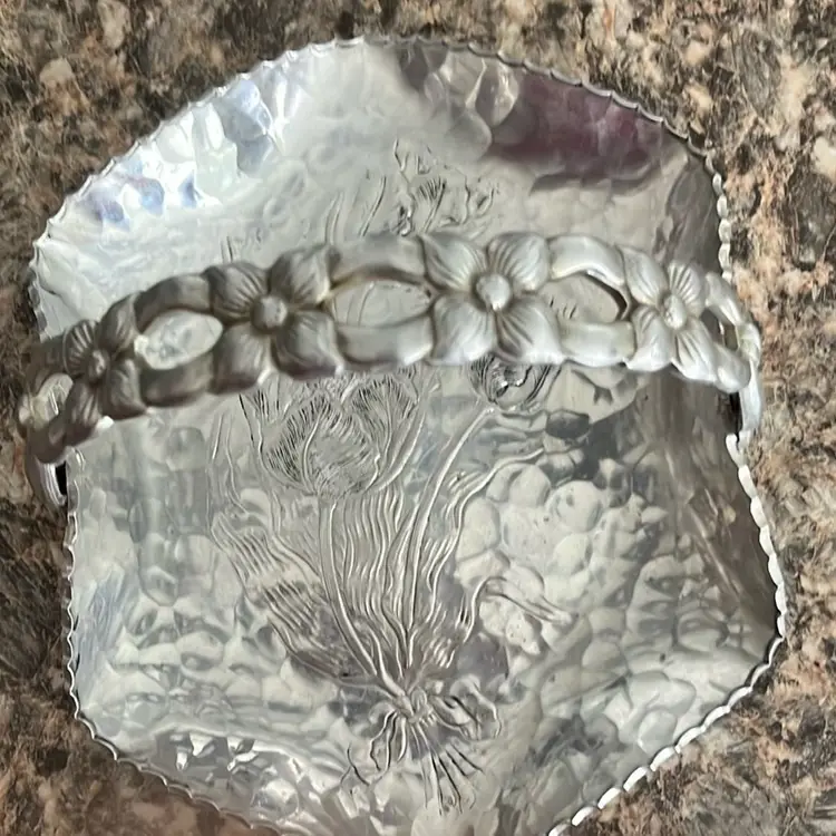 Rodney Kent hammered aluminum basket with floral handle and embossed floral design.