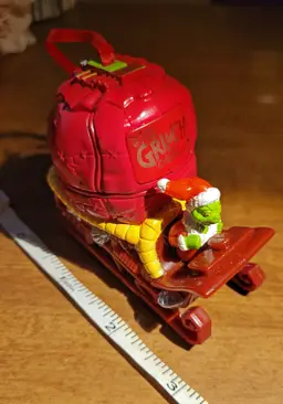 Vintage Dr. Seuss Grinch Rolling Sled Ornament c. 2000