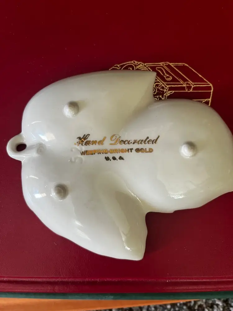 A vintage "Weeping Bright Gold" leaf-shaped trinket or candy dish