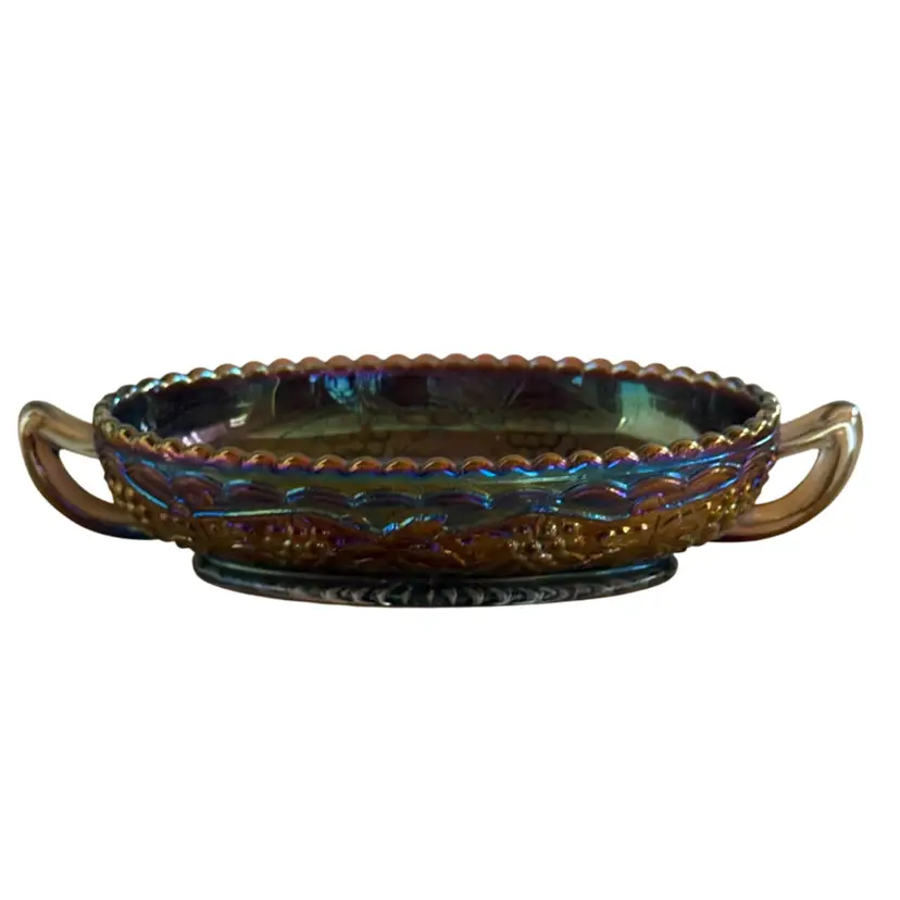 Imperial Glass carnival glass oval relish dish featuring the "Grape and Cable" pattern with handles and a saw-tooth rim