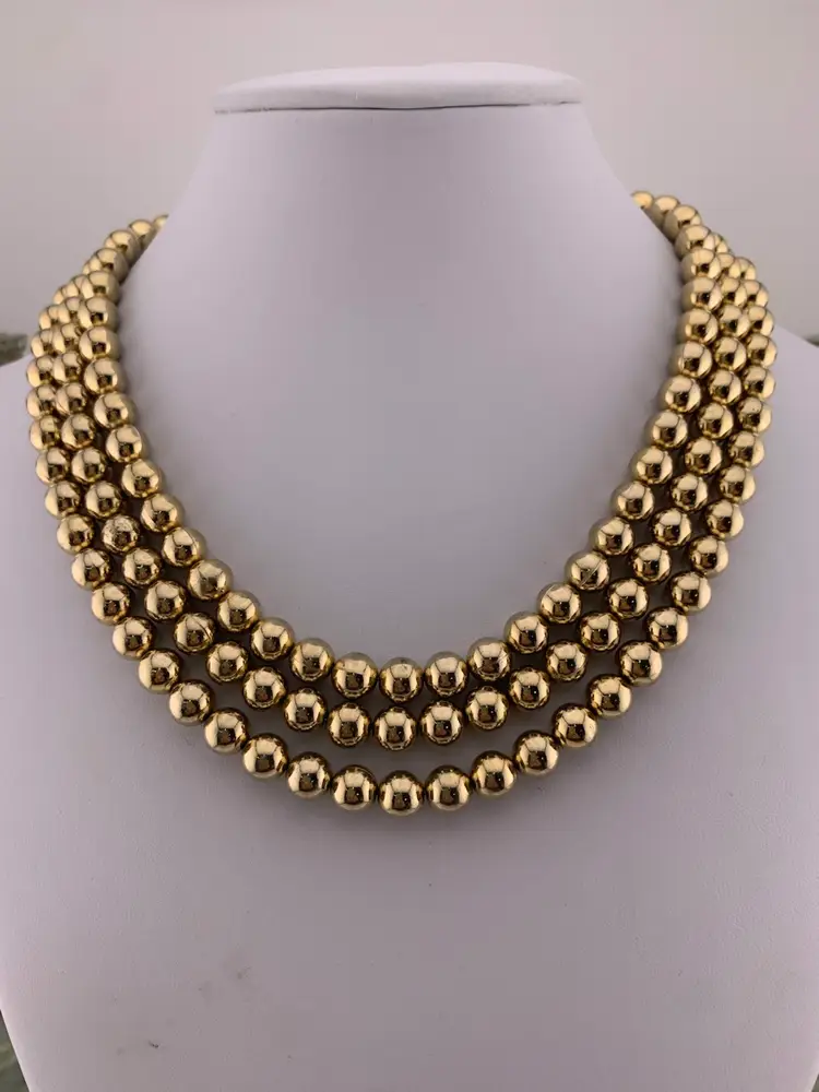 Coro Triple Strand Gold Tone Ball Necklace.