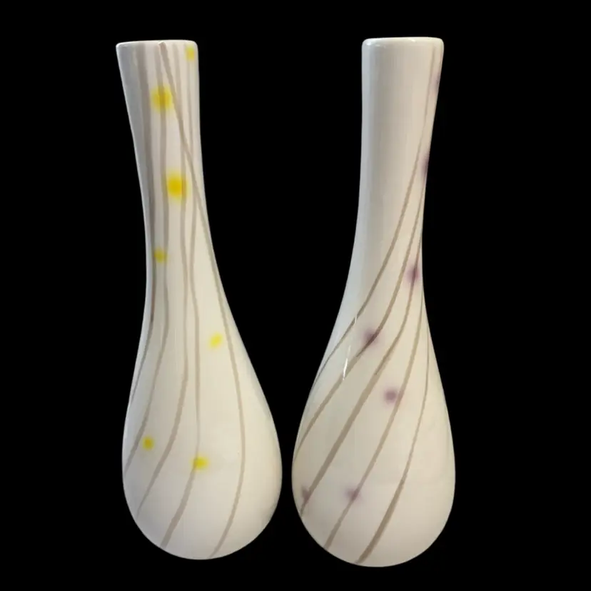 Pair of contemporary ceramic vases with abstract line and dot decoration.