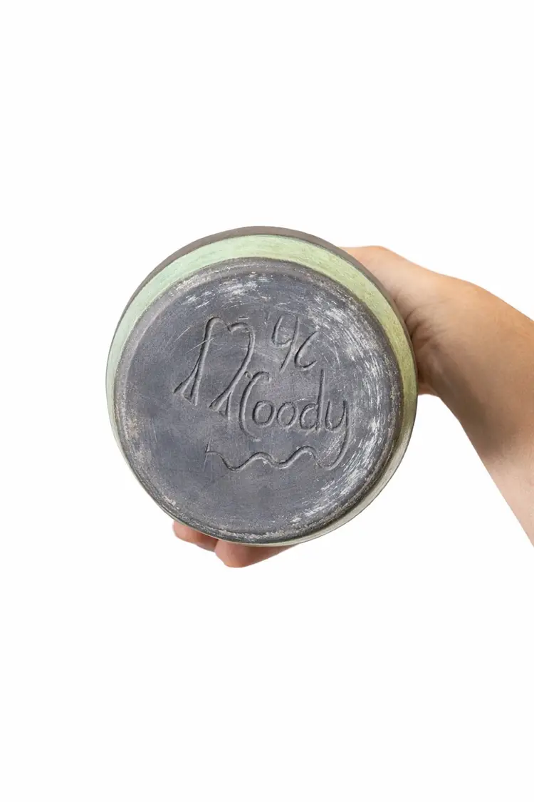 Beautiful signed studio pottery vase by D. Moody (1996). Hand-thrown with a charcoal body, carved detailing, and  turquoise crackle