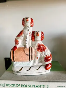 Staffordshire England Spaniel Dogs On Barrel