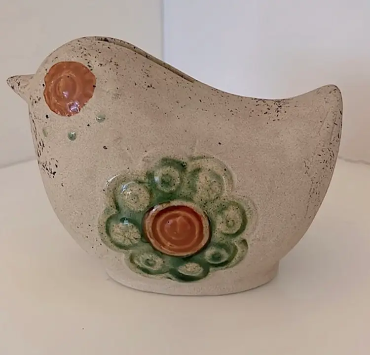Sweet pottery bird bank with hand painted/glazed rust eyes and green wings!