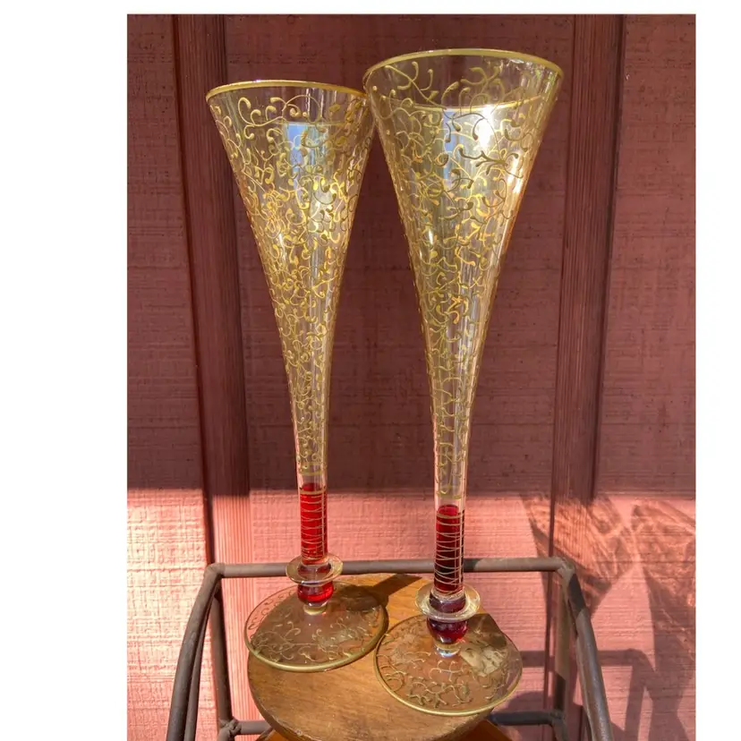 Pair Of 10.75”h Pier 1 Glass Champagne Flutes, Clear & Red With Gold Paint Decor.