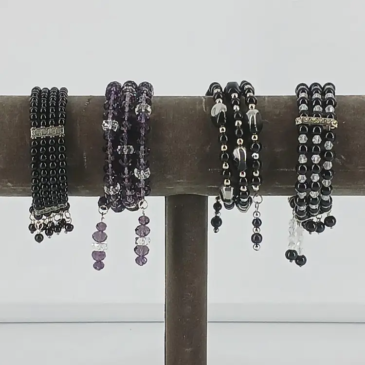 Four Black Glass Coil Bracelets