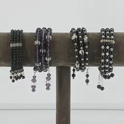 Four Black Glass Coil Bracelets