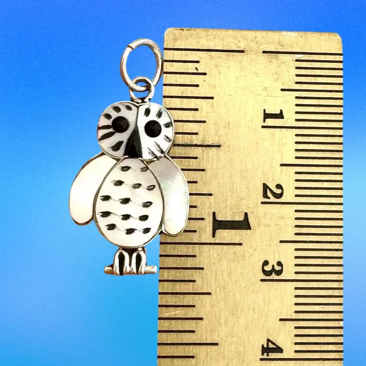 # 2 Sterling Silver Zuni Inlaid Pendant Signed