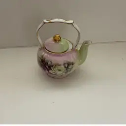 Small Floral Teapot.  Porcelain Treasures
Decorated by Betty Platner
