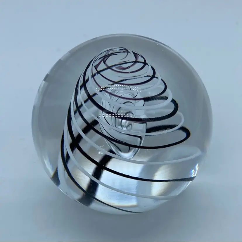 #0057 Studio Ahus Sweden art glass paperweight with pulled black and white stripes.