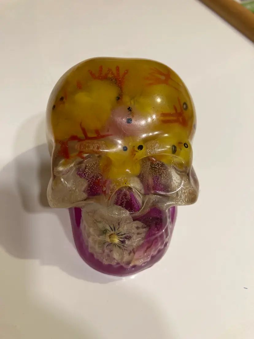 Resin skull with baby chicks for brains
