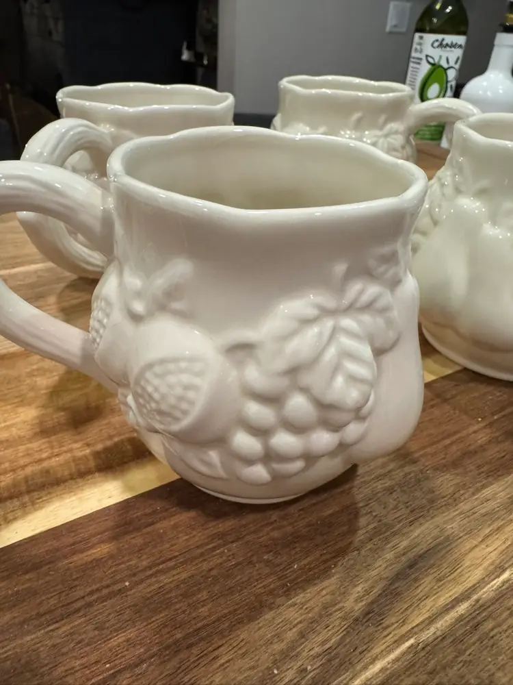 Four White Ceramic Mugs