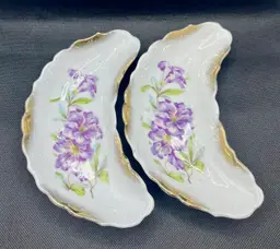 Antique crescent shaped porcelain bone dishes or trinket plates with purple floral design and gold gilding