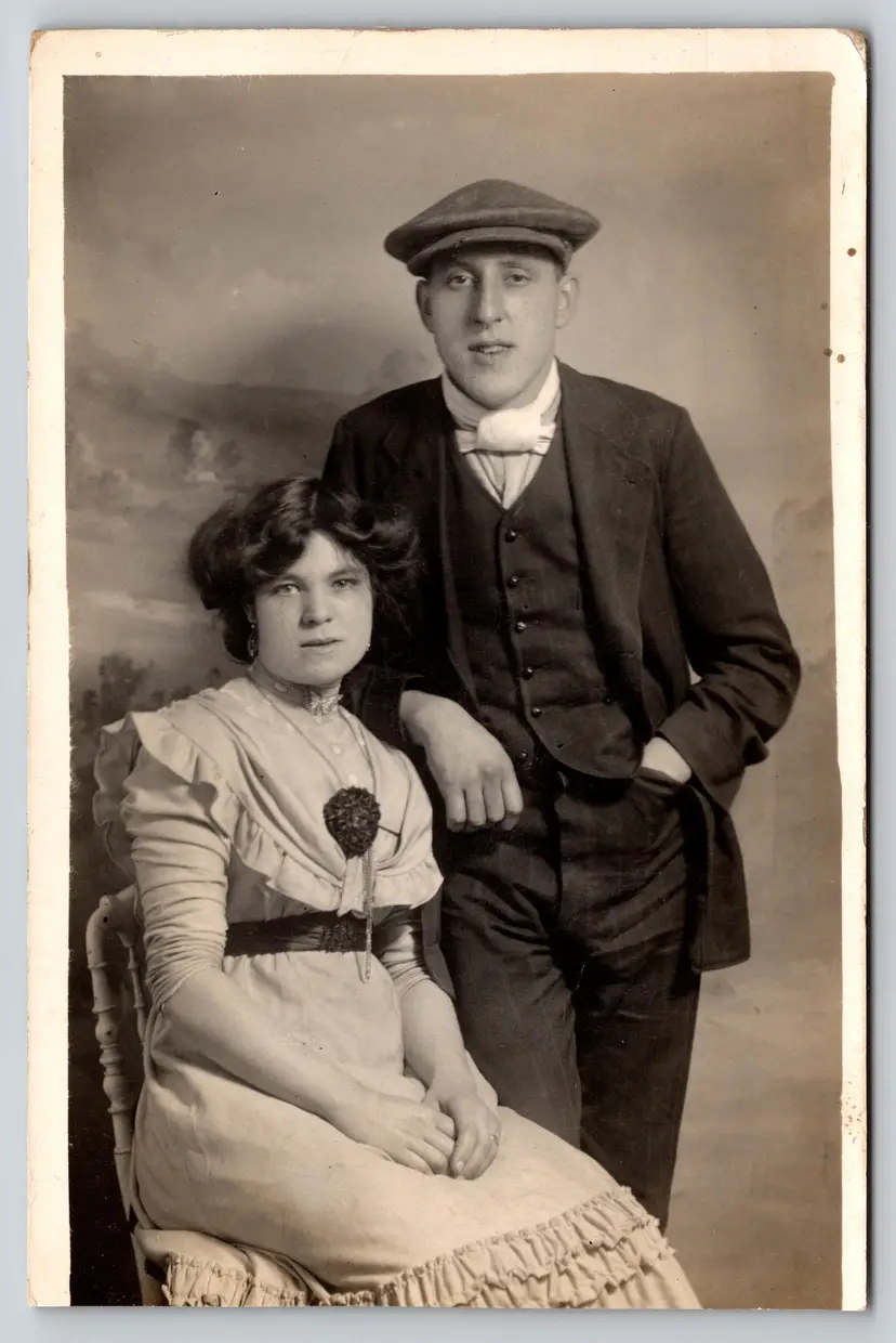 Postcard RPPC Husband and Wife Seated Real Photo Husband with Scally Cap - 9287