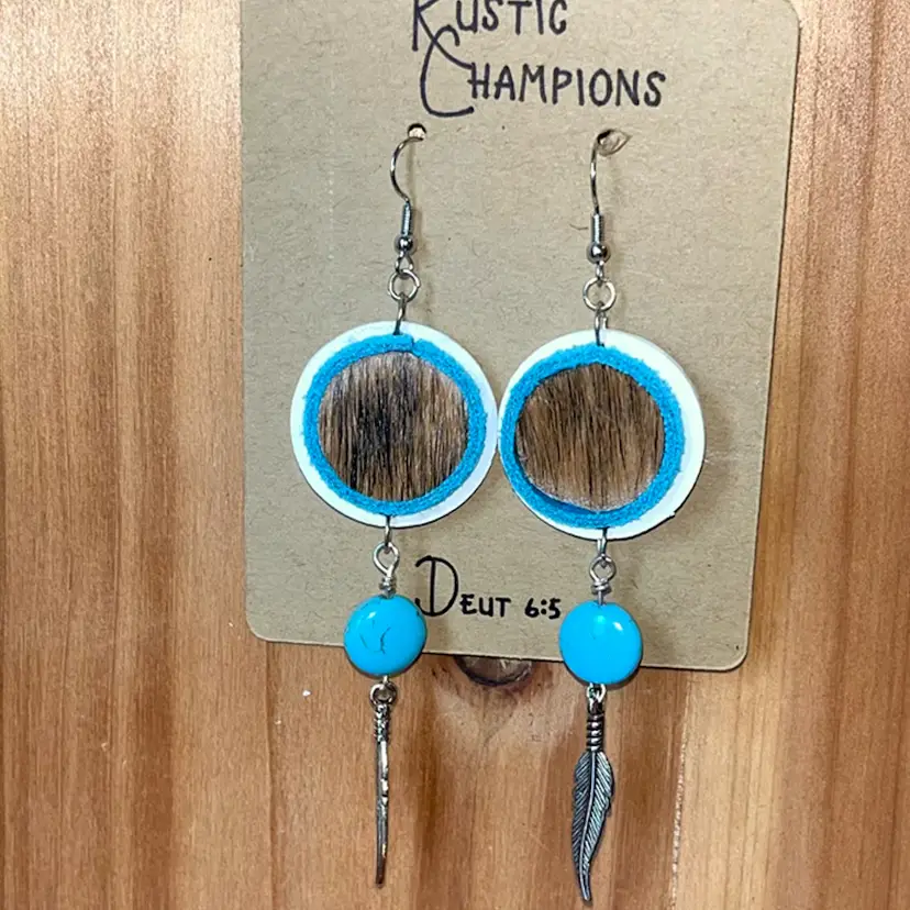 Cowhide And Turquoise Colored Leather With Faux Turquoise And Silver Feather