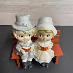 Inv. 6008 Pilgrim Boy And Girl On Plastic Bench With Books