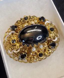 Vintage Black glass 'Hematite' cabochon with gold tone filigree brooch - circa 1950's