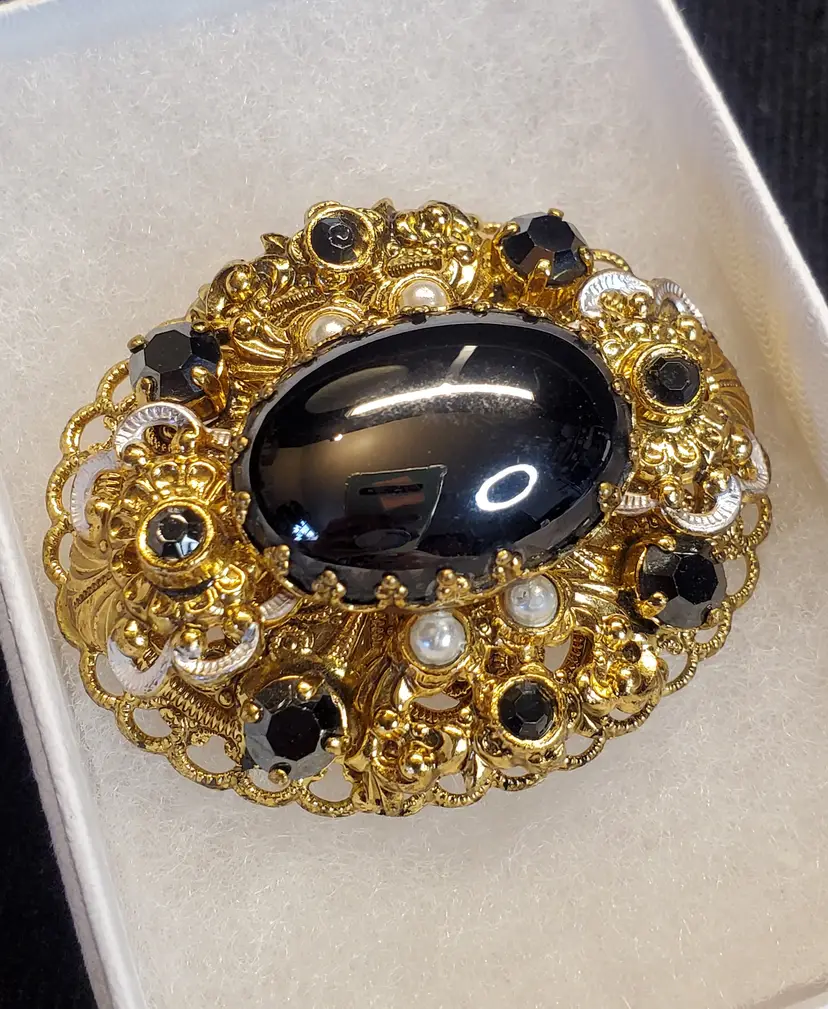 Vintage Black glass 'Hematite' cabochon with gold tone filigree brooch - circa 1950's
