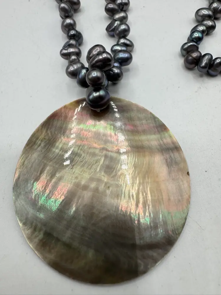 # 53 Mother Of Pearl Pendant On A Genuine Oil Slick Pearl Necklace 16”