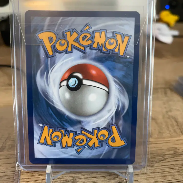 Team Rocket's Meowth 149/182 Cosmos Holo Pokémon card from the Destined Rivals set.