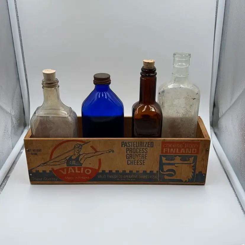 Vintage Glass Medicine Bottles in Old Wooden Finland Cheese Box