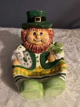 #01 A ceramic leprechaun figurine Bowl  with "100% IRISH" inscription.