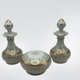 Vintage Porcelain Vanity Set Including 2 Perfume Bottles With Stoppers (5-1/2”) And A Lidded Powder Or Trinket Box ( 3-1/2”)