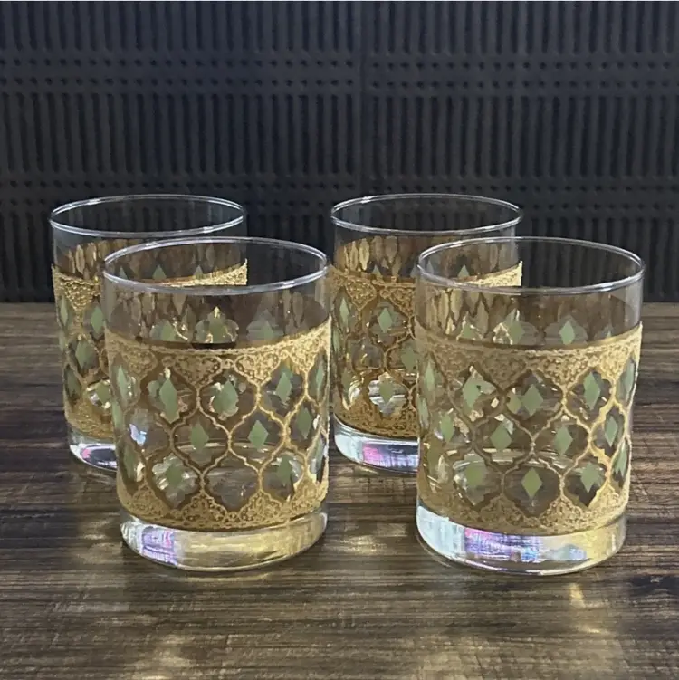 Used. An item that has been used previously. The item may have some signs of cosmetic wear, but is fully operational and functions as intended. This item may be a floor model or store return that has been used. See the seller’s listing for full details and description of any imperfections. See all item conditions. Vintage Culver “Valencia” lowball glass, featuring the signature 22-karat gold lattice design with olive-green diamond insets. A striking example of Mid-Century Modern barware, known for its elegant geometric motif and rich metallic detailing. Perfect for whiskey, cocktails, or as a collectible display piece.   Details:  • Brand: Culver Ltd.  • Pattern: Valencia  • Style: Lowball / Old Fashioned Glass  • Era: Mid-Century Modern (1960s)  • Material: Glass with 22K gold overlay and green enamel accents