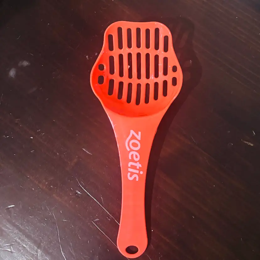 Bright Red Litter Scoop with Ergonomic Handle used and in good condition
